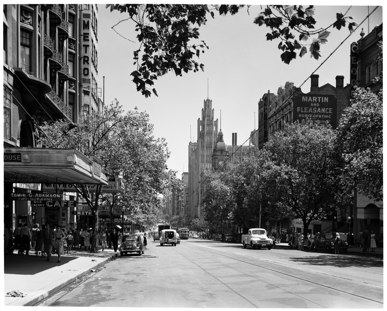 Victorian Railways, photographer - Dec. 1954 - Manchester Unity Building towers above Collins Street - H91.3304235